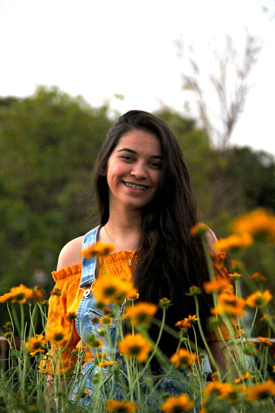 woman-in-blue-and-white-floral-tank-top-standing-on-yellow-flower-field-during-daytime.jpg woman in blue and white floral tank top standing on yellow flower field during daytime